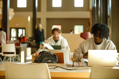 Students, including Aaron Hitchcock, study in the Golisano Community Engagement Center.