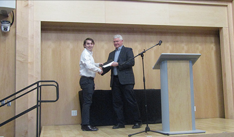 Andrew Snel receives award.