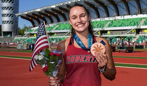 Brynn King smiles with medal