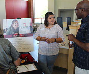 Professor Lindsey Mwene speaks to visitors.