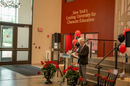 Dave Basinger speaks at podium during retirement ceremony