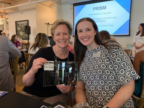 Donna McLaren and Courtney O’Gorman smile with PRism Award