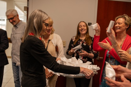 Dr. Berry smiles with others at ice cream celebration