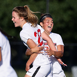 Jenna Norhtrup celebrates with teammate during game