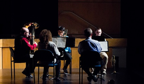 The brass quintet performs.