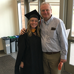 Sam and her father when she received her master’s degree