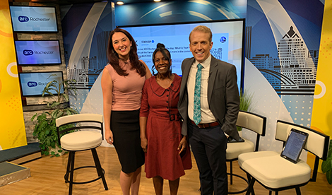 Sonnette Bascoe in the studio with news anchors.