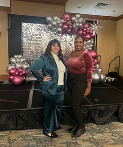 Jennifer Rivera and Yoscaira Gomez smile at ceremony