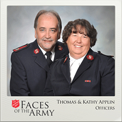 Thomas and Kathy Applin smile for photo. Underneath it has the Salvation Army Logo and Faces of the Army, Thomas & Kathy Applin, offices.