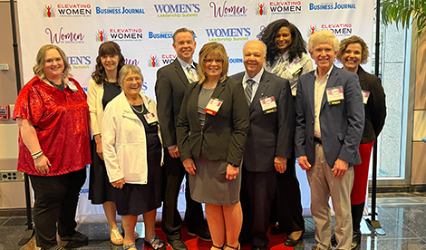 Group of attendees at the Women of Excellence ceremony.