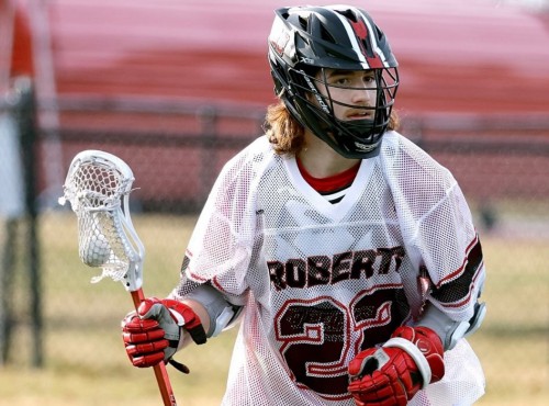 Gunner MacMillan plays lacrosse